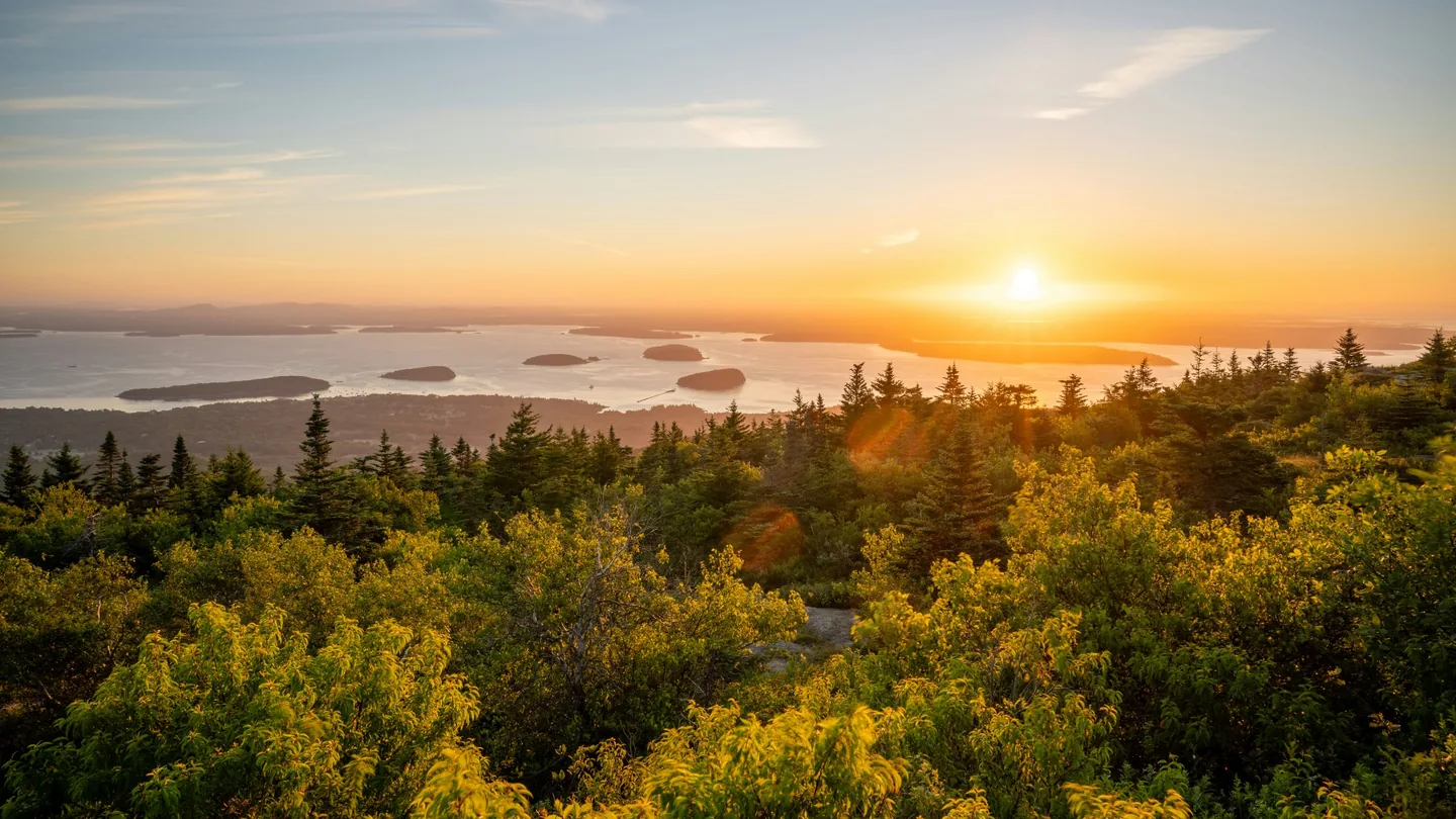 Sunrise from Cadillac Mountain overlooking Frenchman Bay and its islands in Acadia National Park