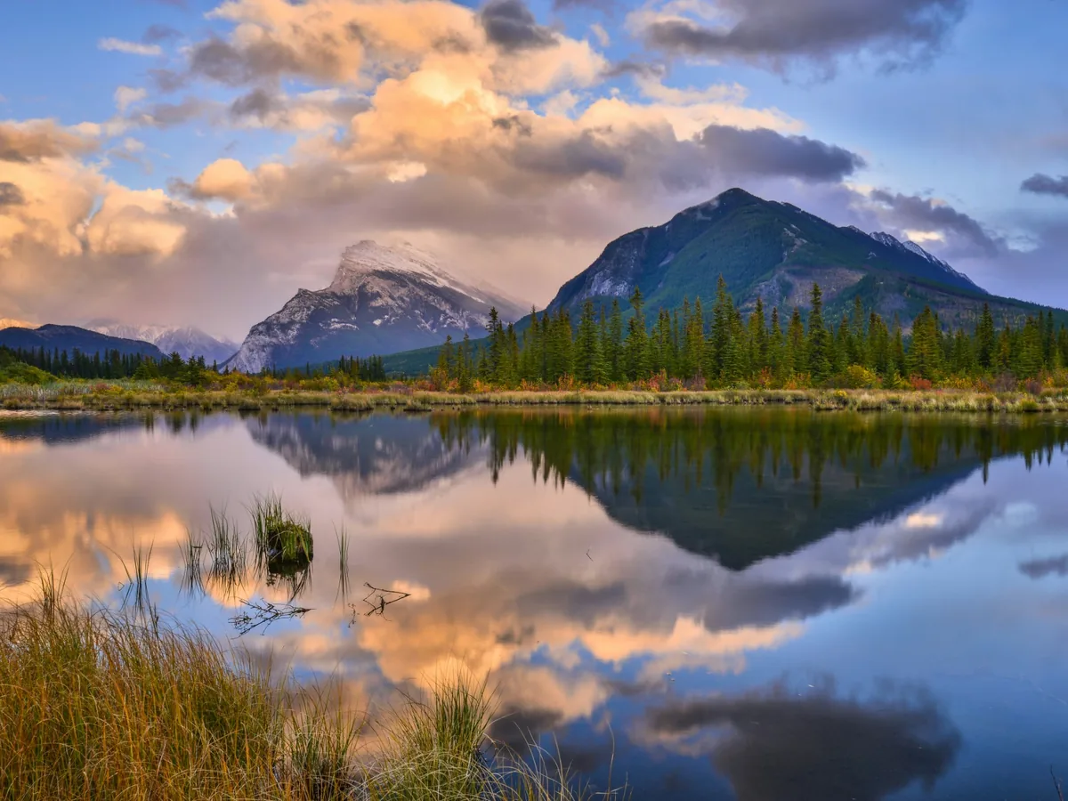 Vermilion Lakes reflecting Mount Rundle and warm sunrise clouds in Banff National Park