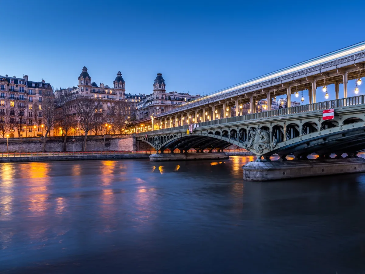 Pont de Bir-Hakeim over the Seine illuminated against a cobalt twilight sky