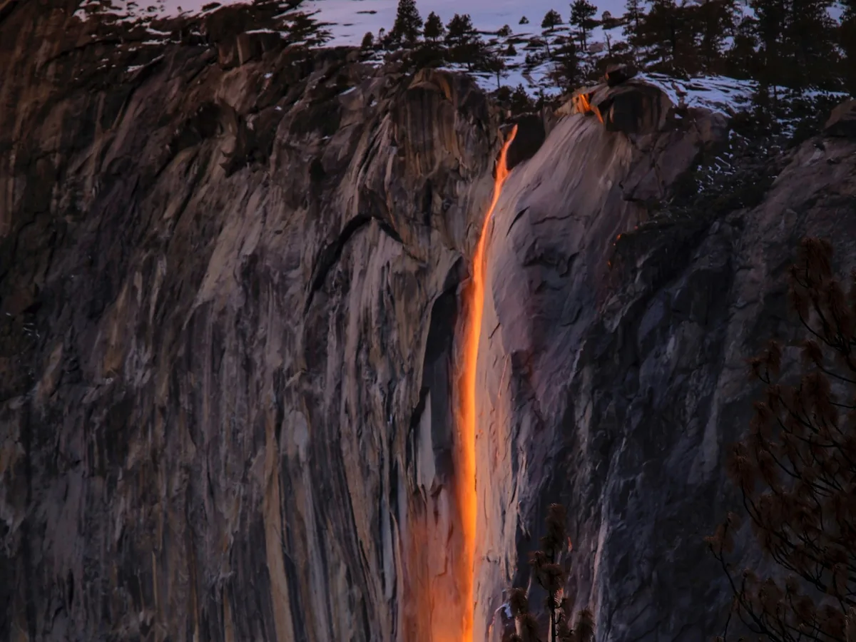 Horsetail Fall glowing orange during the seasonal Yosemite Firefall phenomenon